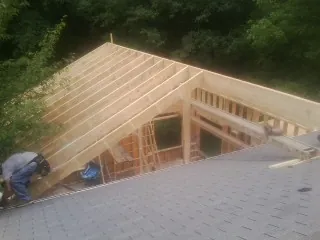 Framing a new roof addition that ties into an existing shingle roof in Menan